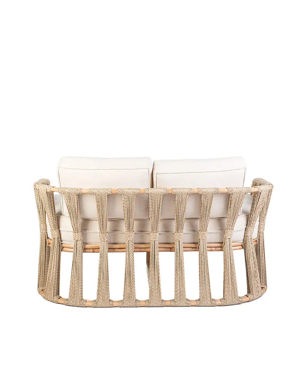 Rattan loveseat with white cushions on a white background