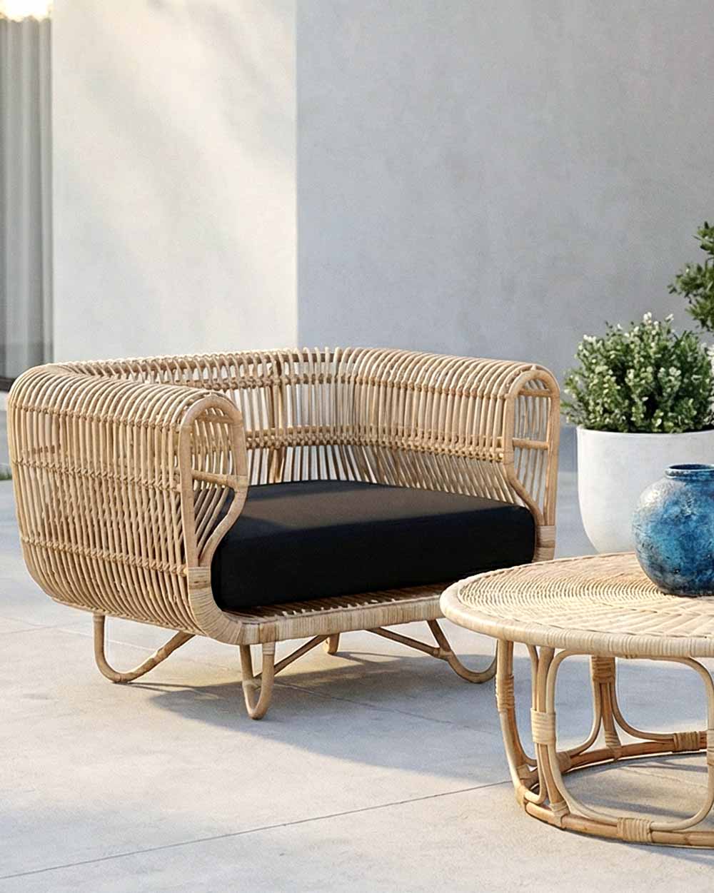 Wicker outdoor furniture set with a cushion on a patio