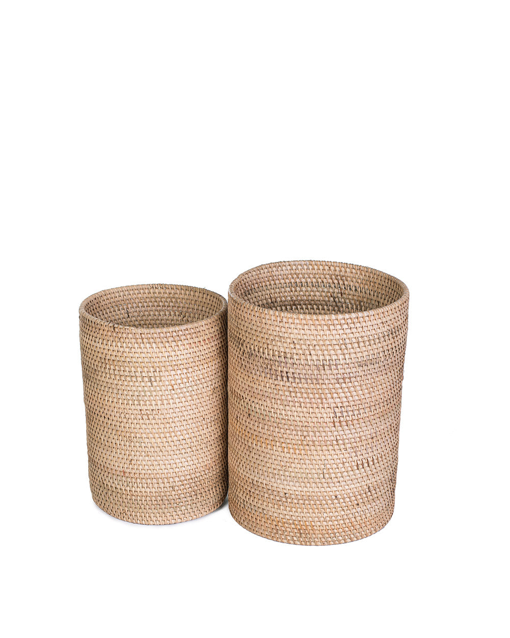 Two cylindrical rattan baskets with natural color, handcrafted with visible weaving patterns.