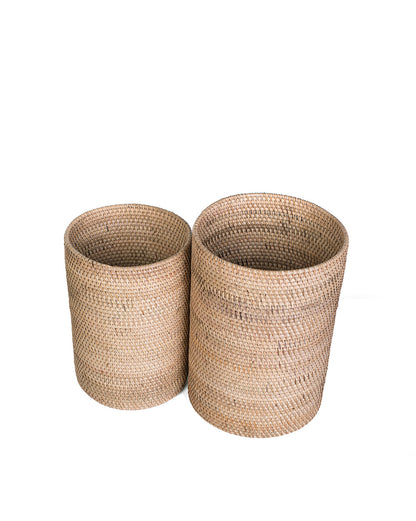 Two rattan bins in white background.