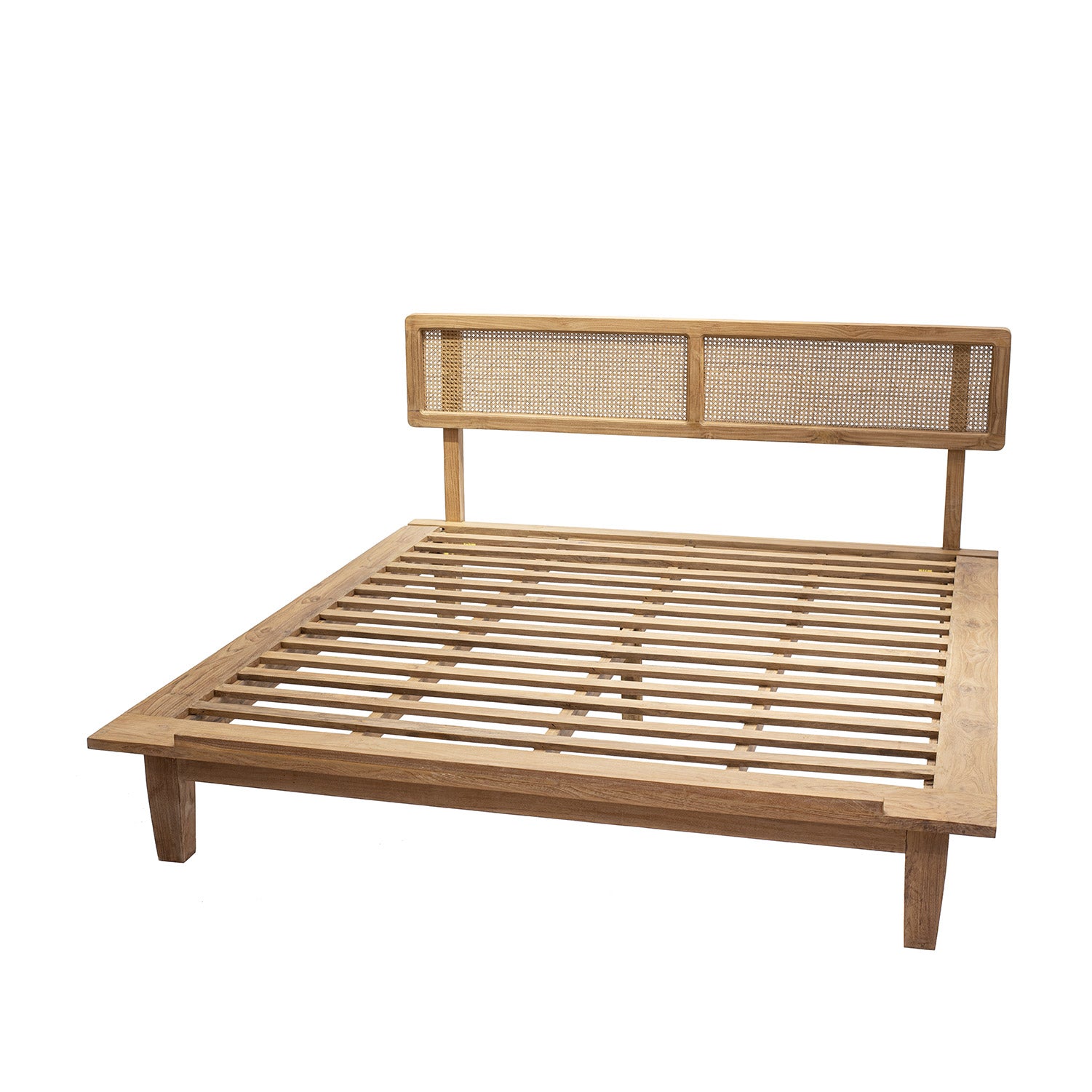 A natural color teak wood bed frame with a rattan headboard.