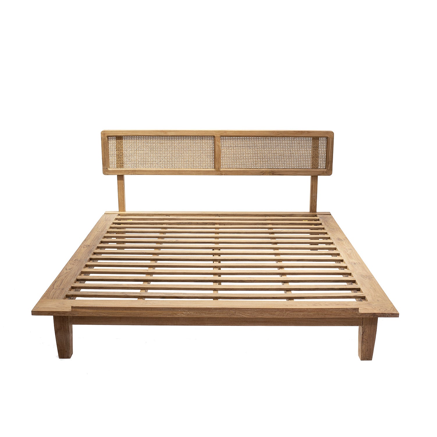 A natural color teak wood bed frame with a rattan headboard.
