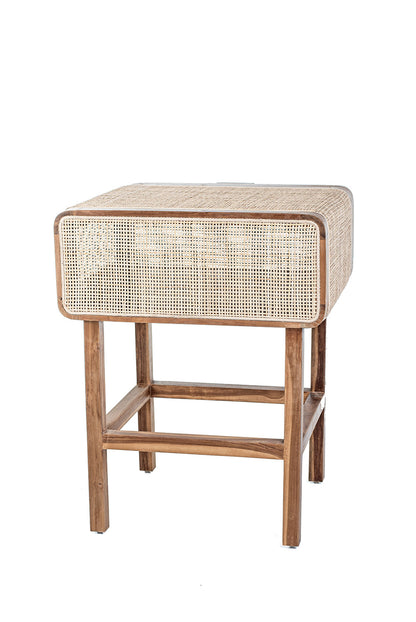 A rustic side table made of teak wood and rattan, having a natural color and Ethnic style.