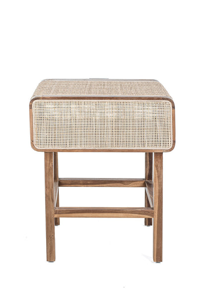 A rustic side table made of teak wood and rattan, having a natural color and Ethnic style.