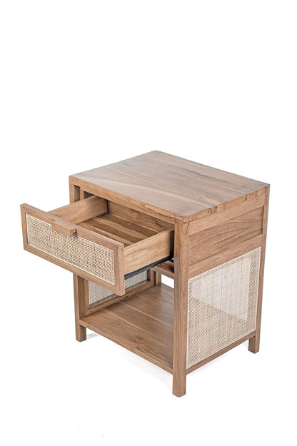 A rectangular side table made of teak wood with a rattan drawer and shelf, set against a white background.