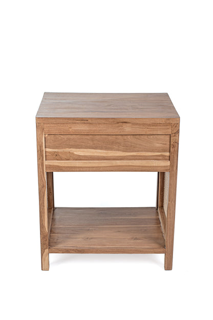 A rectangular side table made of teak wood with a rattan drawer and shelf, set against a white background.