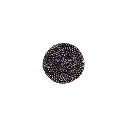 A single black rattan coaster with a round shape displayed on a white background.