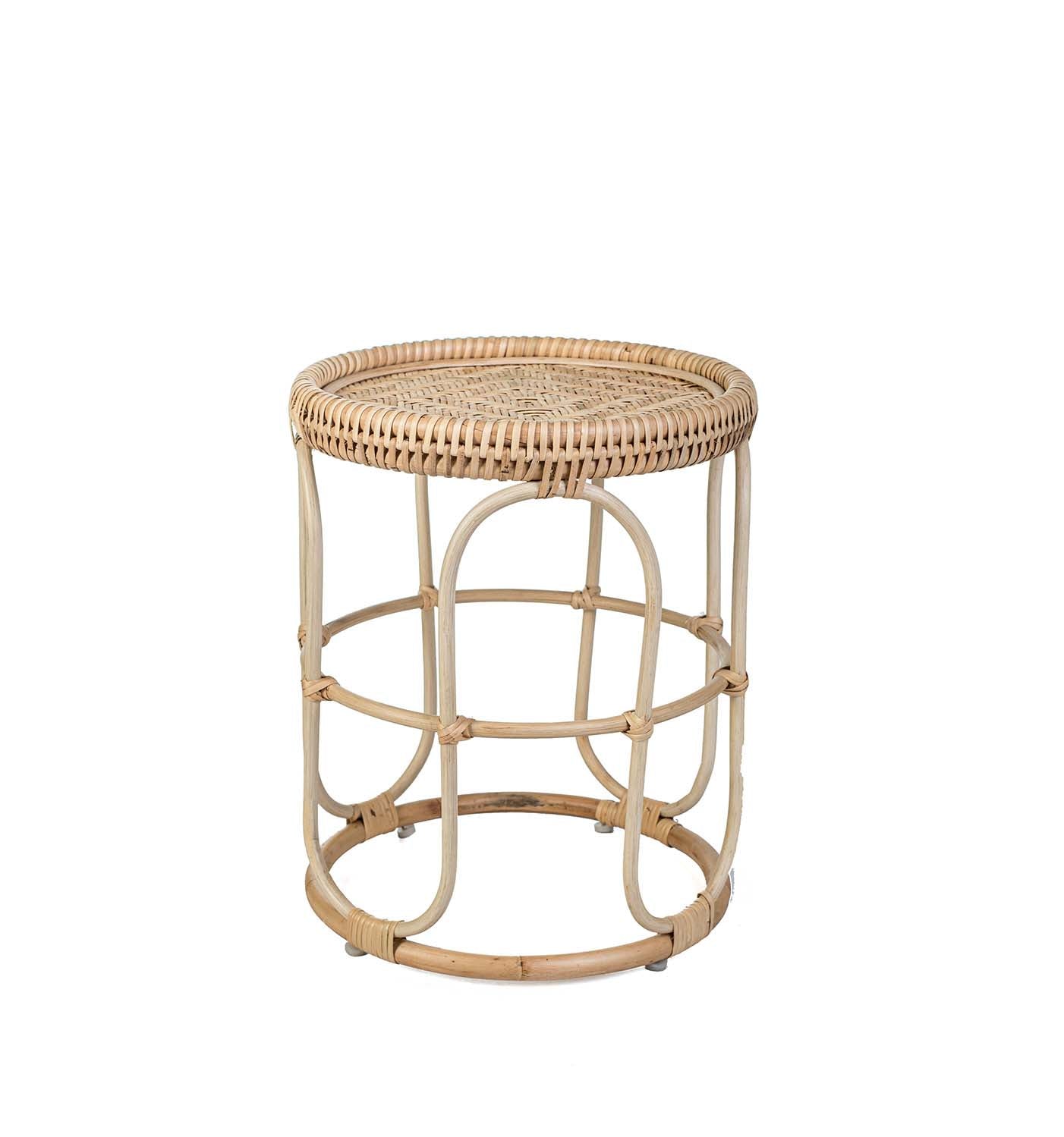 Rattan side table with woven top on a white background