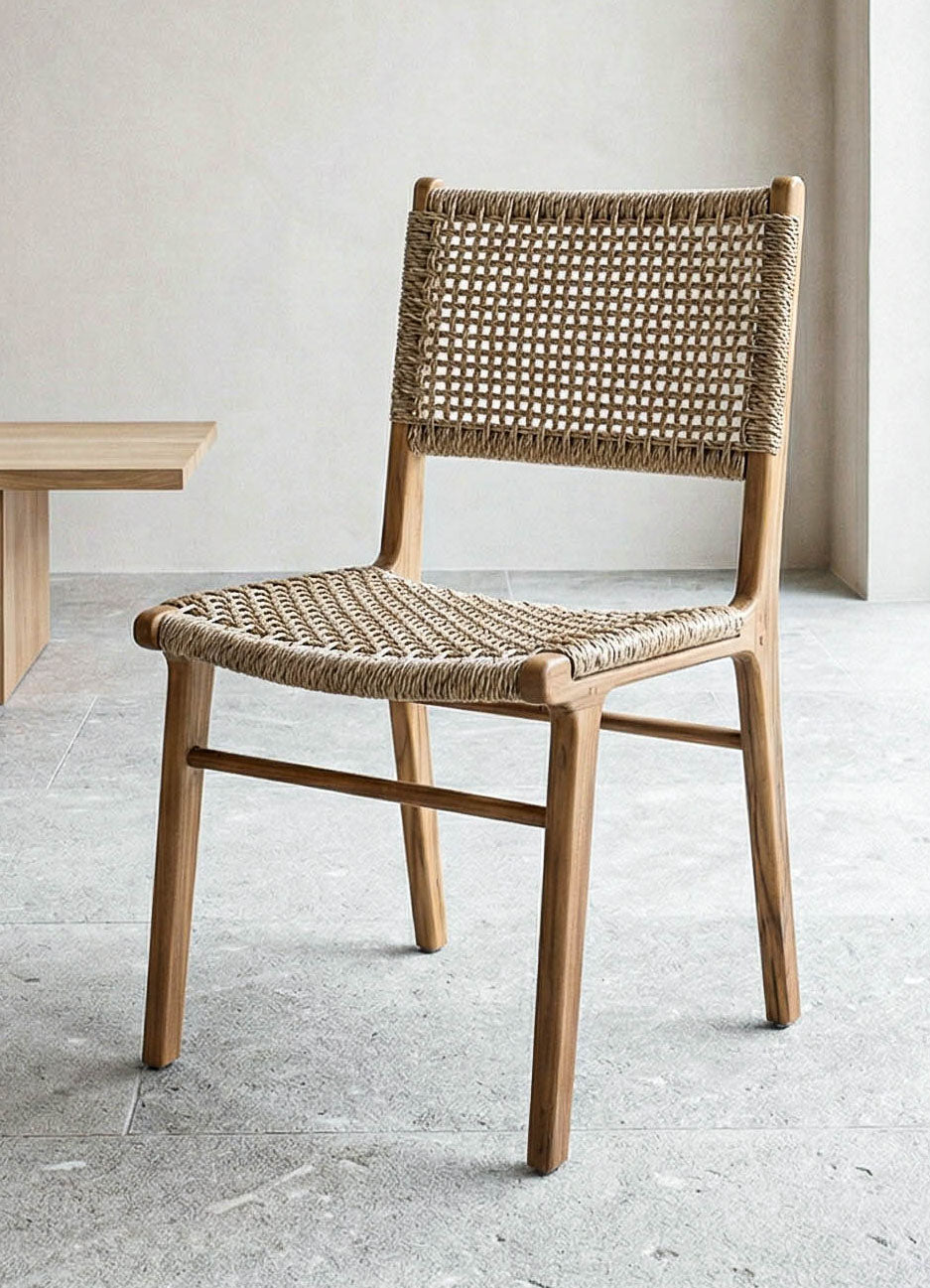 Wooden chair with woven seat and backrest on a light gray floor.