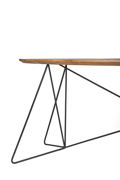 Table made of exotic wood and featuring sleek iron legs on a white background. 