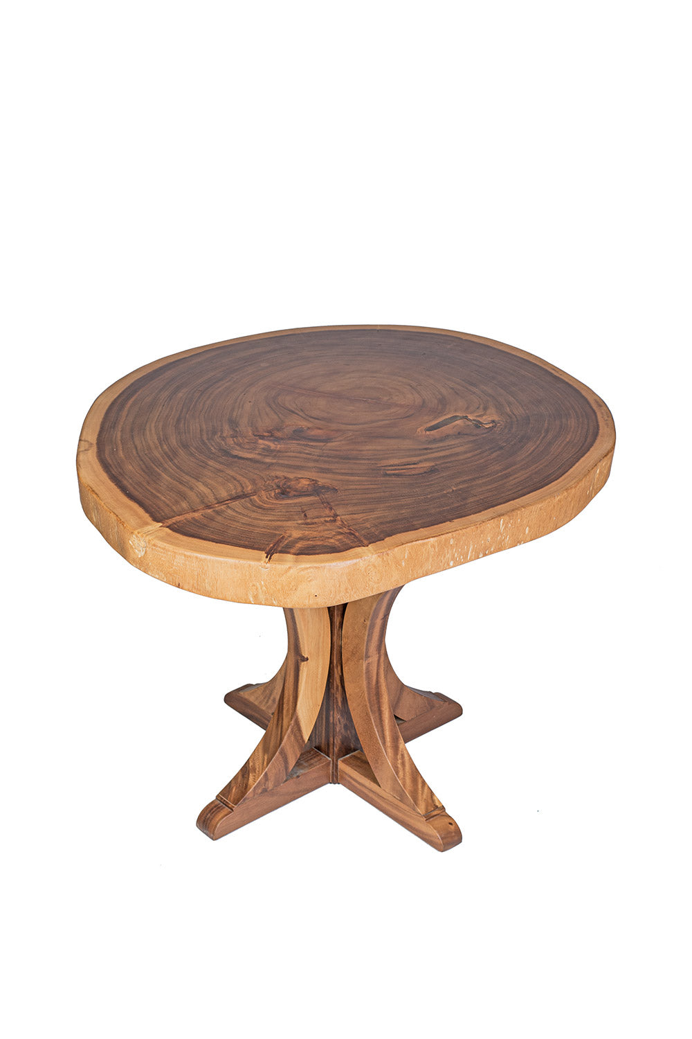 A round dining table made of natural suar wood with a pedestal base, showcasing a rustic design.
