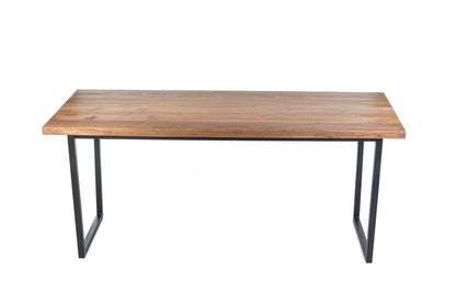 A rectangular dining table with a natural wood finish and black iron legs.