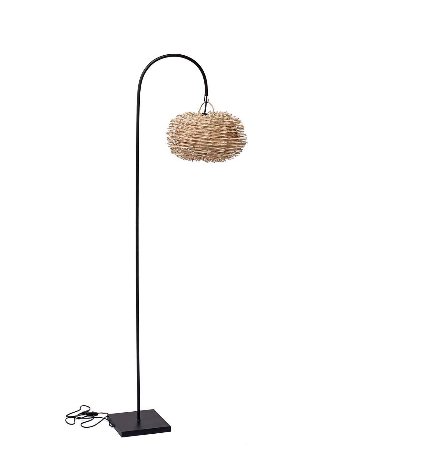 Floor lamp with a wicker shade on a white background