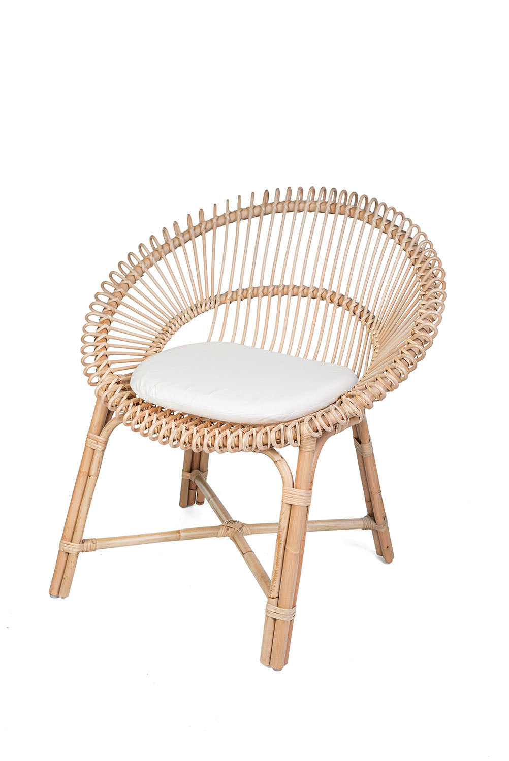 Wicker chair with a white cushion on a white background