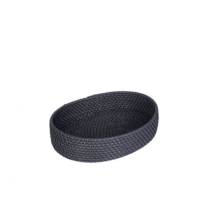An oval-shaped black rattan tray handcrafted in Bali, Indonesia.