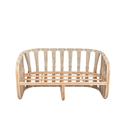 Rattan loveseat with white cushions on a white background