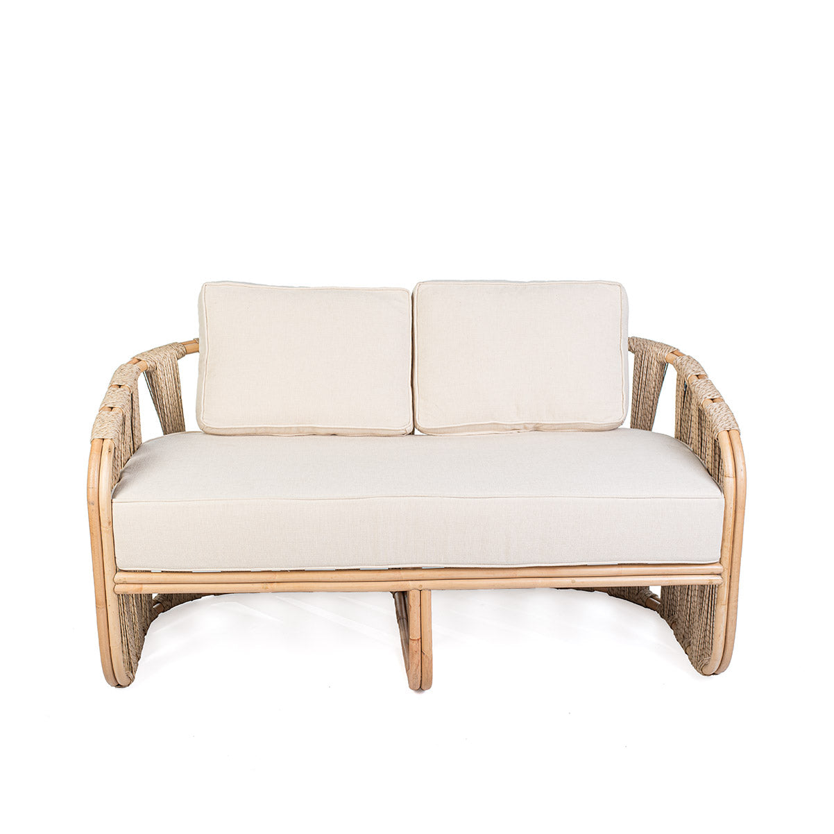 Rattan loveseat with white cushions on a white background