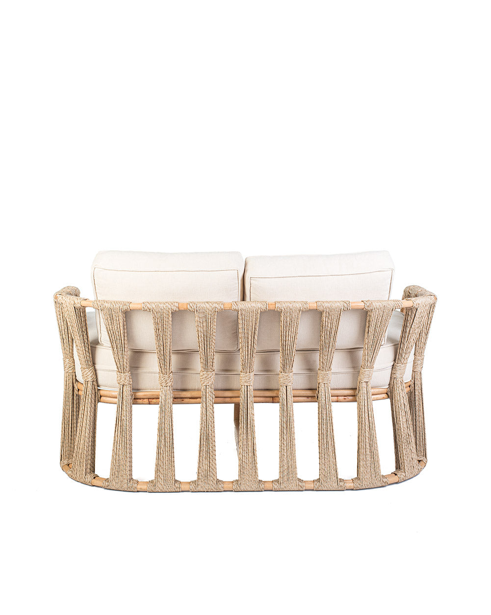 Rattan loveseat with white cushions on a white background