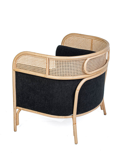 A contemporary style solo sofa with a black cushioned seat and backrest, made of rattan.