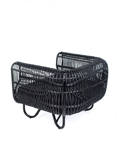 A black rattan solo sofa with a cushion on a white background, showcasing a woven design and a sleek modern look.