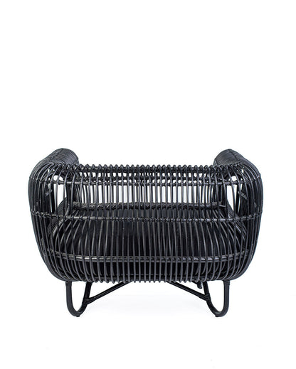 A black rattan solo sofa with a cushion on a white background, showcasing a woven design and a sleek modern look.