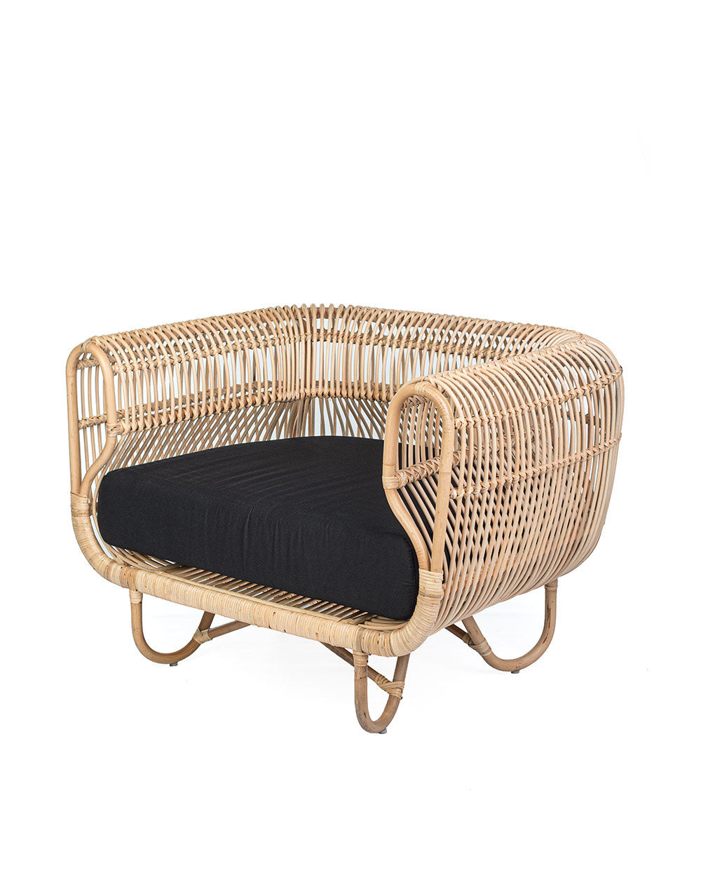 A natural color rattan sofa with black textile cushions.