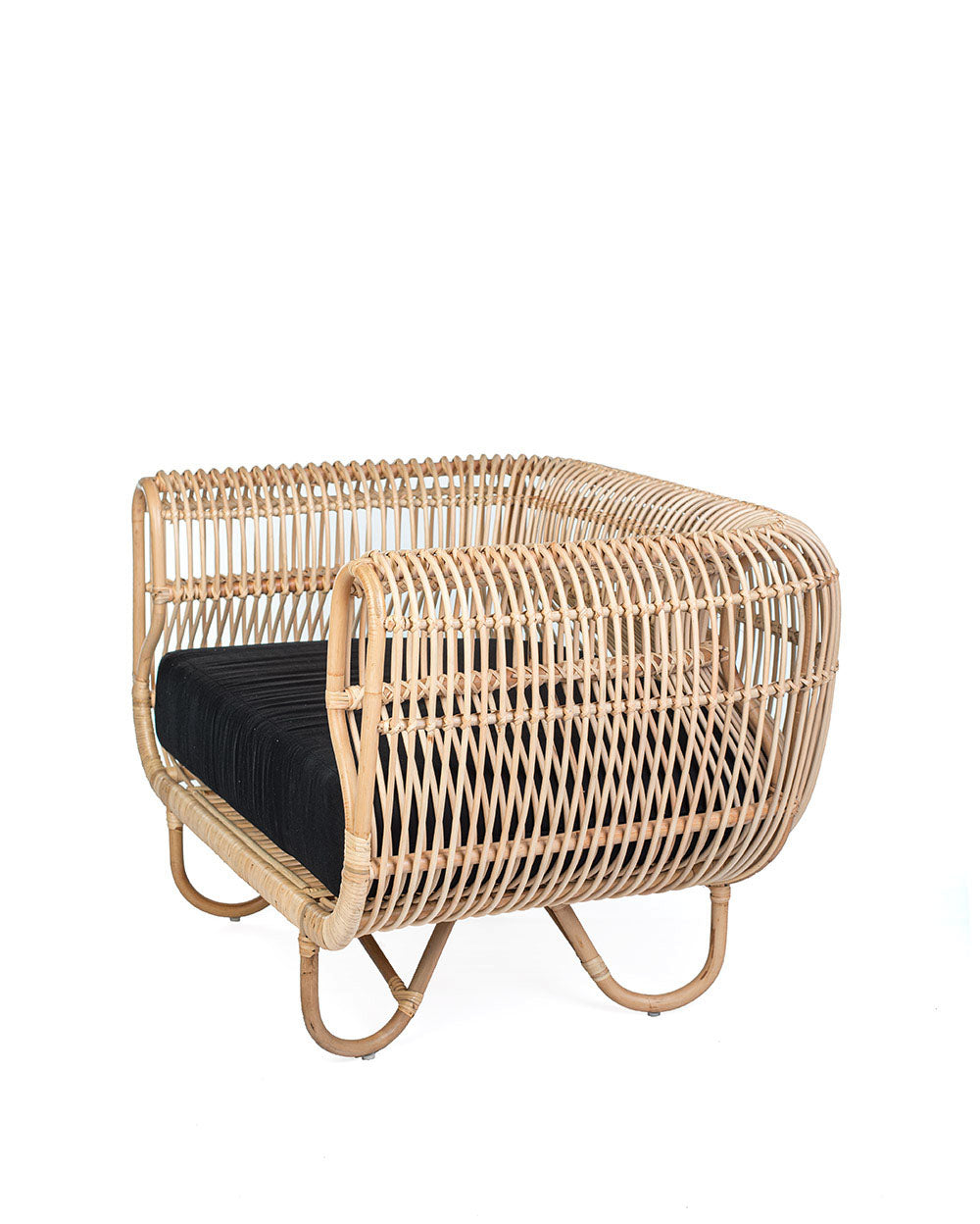 A natural color rattan sofa with black textile cushions.