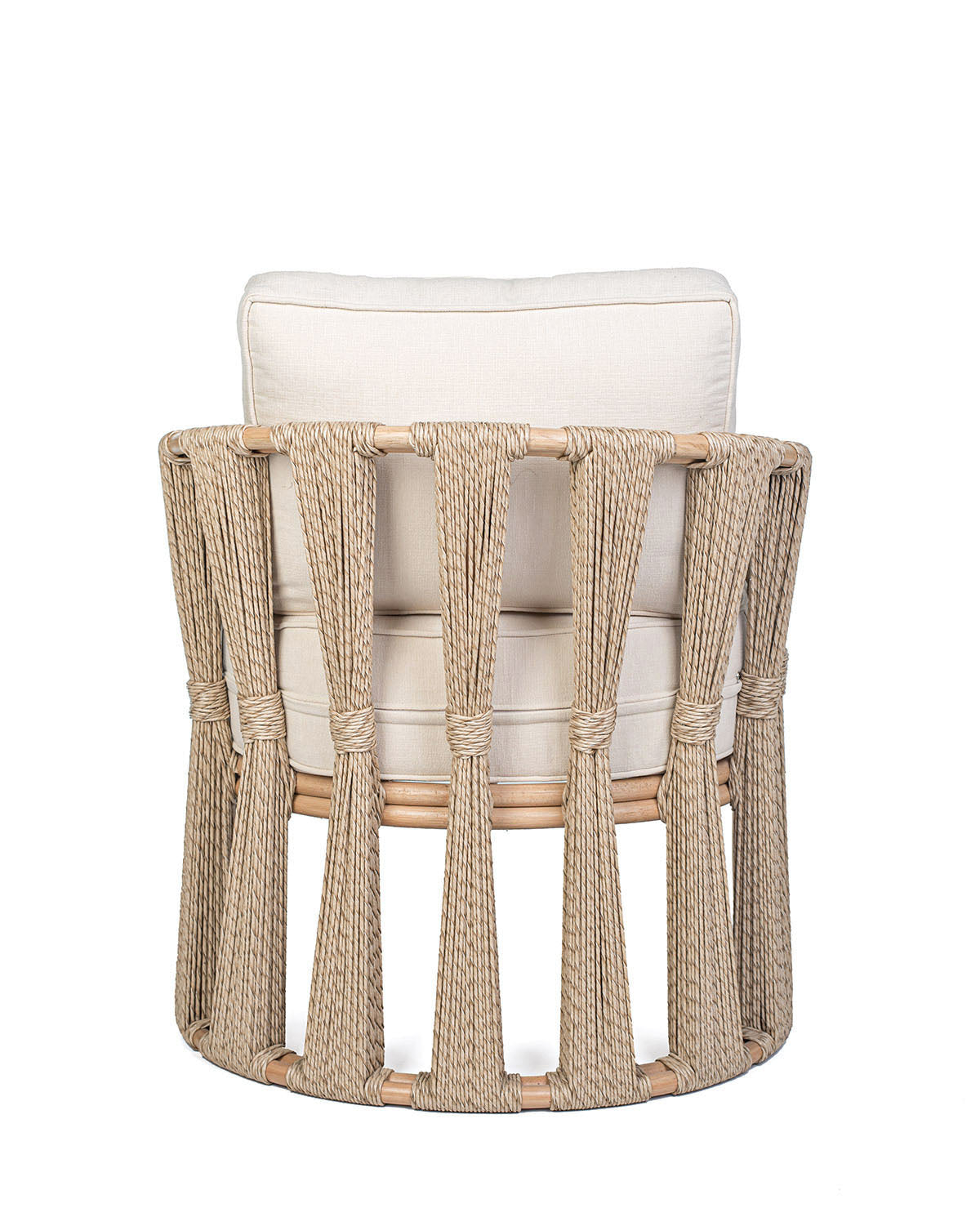 A beige Rattan Solo Sofa with a woven rope design and white textile pillows.