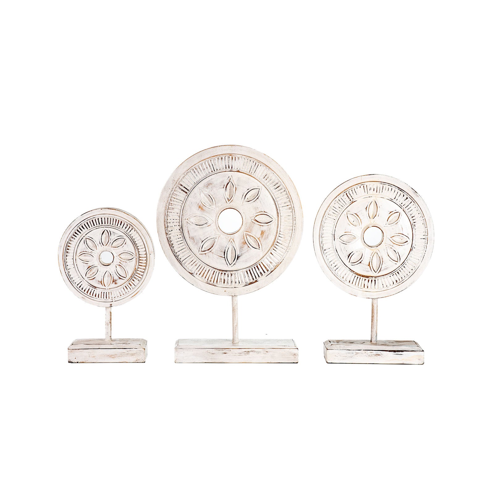 Three decorative circular objects on stands with intricate designs against a white background.