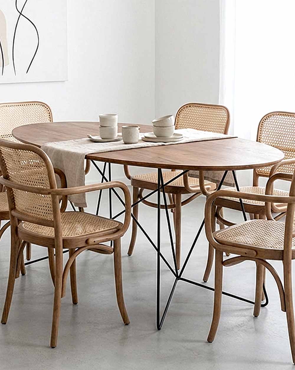 Dining table with chairs in a modern interior setting