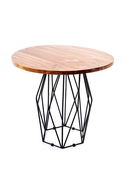 Round bar table with a natural wood finish on the tabletop and a black geometric metal base.