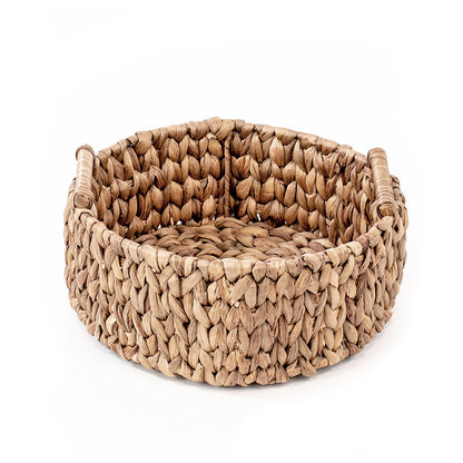 A hand woven natural water hyacinth basket with a open circular shape, featuring a richly textured and colored natural material, suitable for storing everyday items.