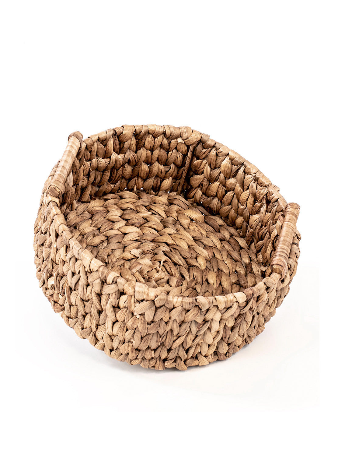 A hand woven natural water hyacinth basket with a open circular shape, featuring a richly textured and colored natural material, suitable for storing everyday items.