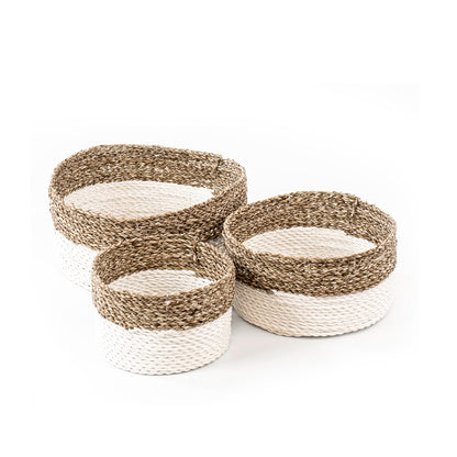 Set of three handwoven baskets made from twisted rattan and macrame, in natural and white colors, displayed on a white background.