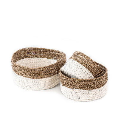 Set of three handwoven baskets made from twisted rattan and macrame, in natural and white colors, displayed on a white background.