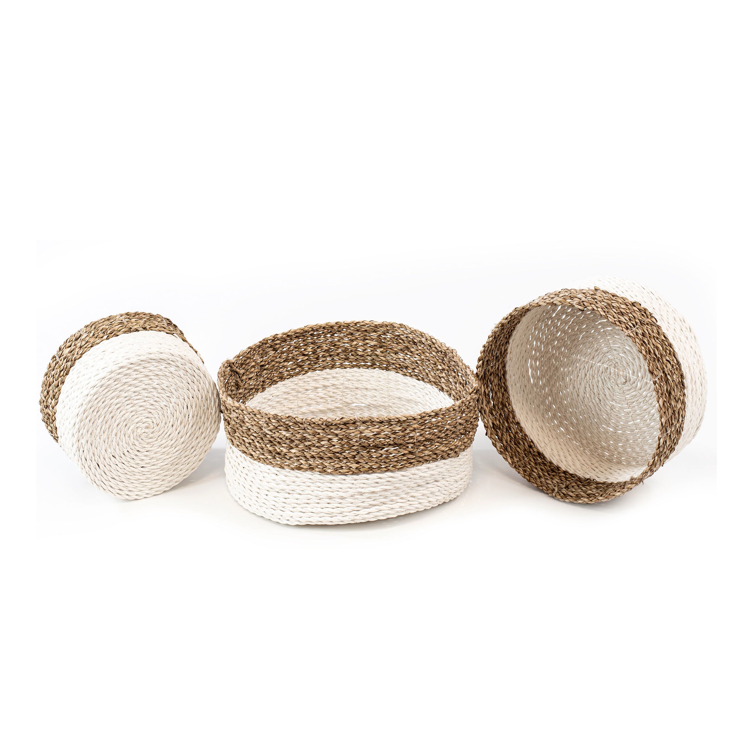 Set of three handwoven baskets made from twisted rattan and macrame, in natural and white colors, displayed on a white background.