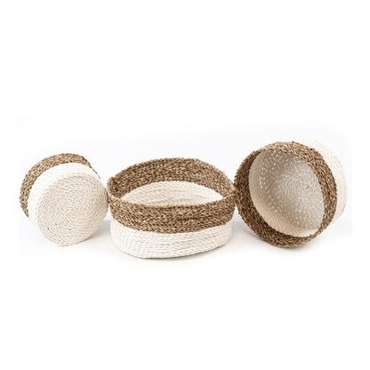 Set of three handwoven baskets made from twisted rattan and macrame, in natural and white colors, displayed on a white background.