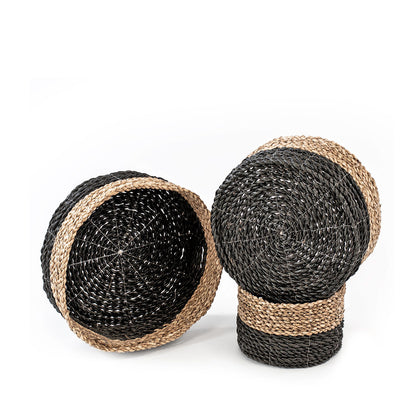 A set of three natural rattan woven baskets in three different sizes, in natural and black color.