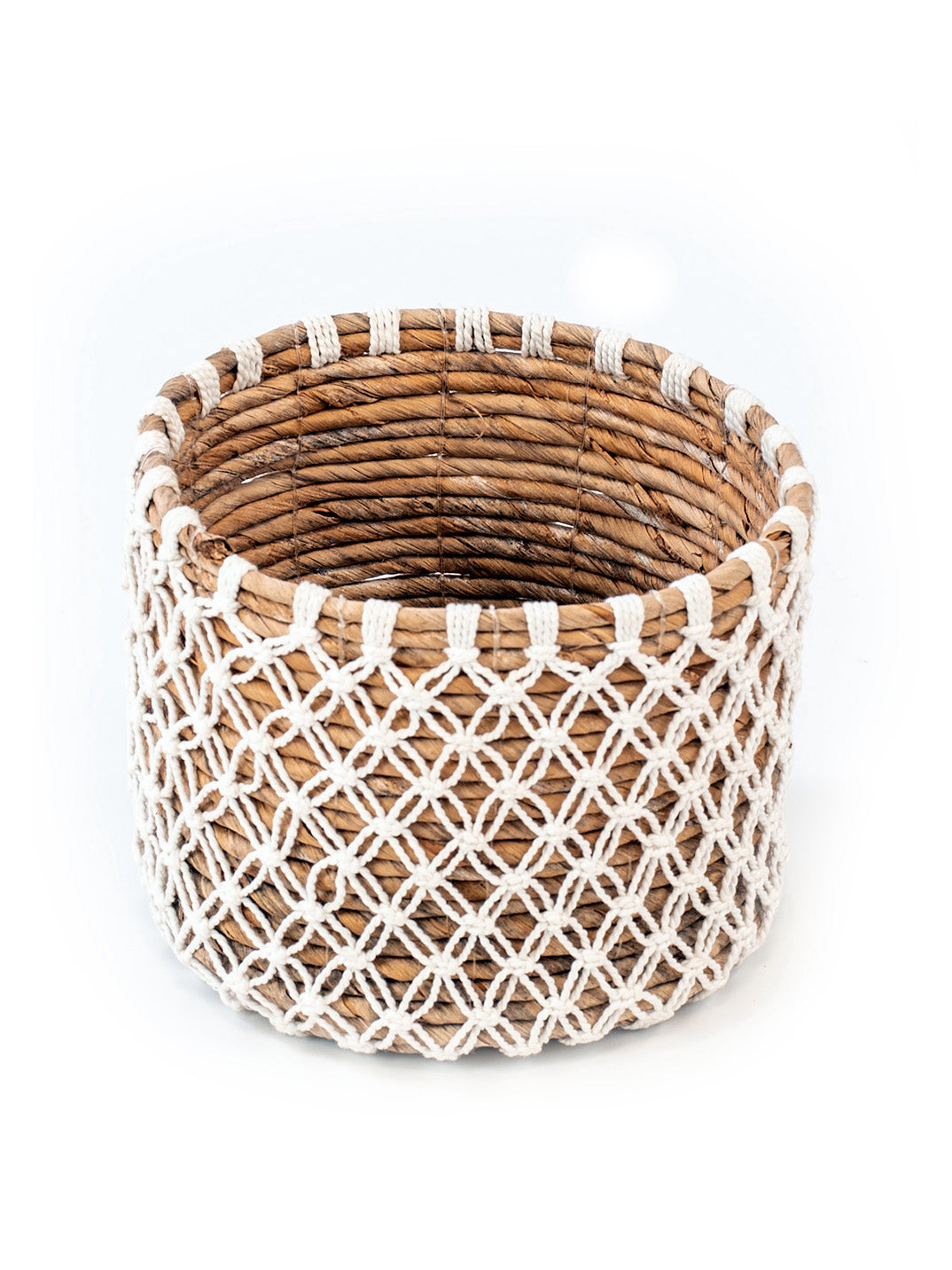 One woven small basket handcrafted from banana leafs and macrame. 