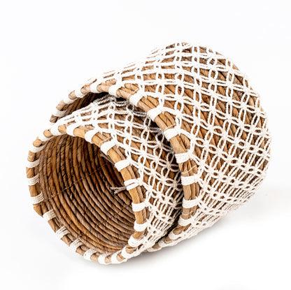 Two woven small baskets handcrafted from banana leafs and macrame. 
