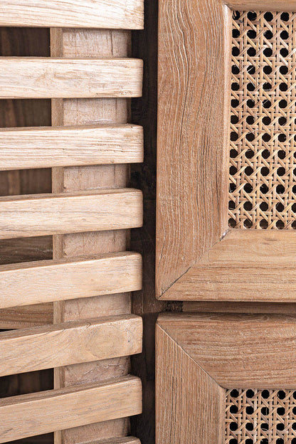 Detail of wooden TV cabinet with rattan drawers, featuring a natural color and an ethnic design.