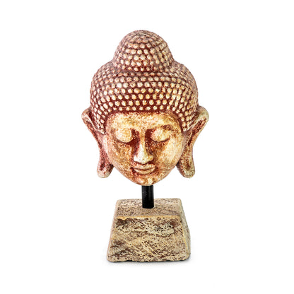 Handmade ceramic Buddha head sculpture on a pedestal, in ocher color.