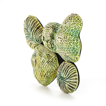 Hand painted ceramic wall decoration depicting marine coral elements in green color.