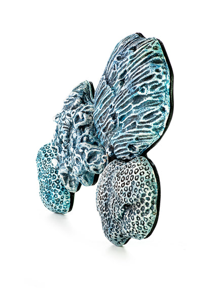 Hand painted ceramic wall decoration depicting marine coral elements in turquoise color.