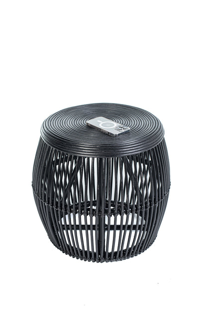 A round black coffee table made of natural rattan, with a geometric pattern, placed against a white background.