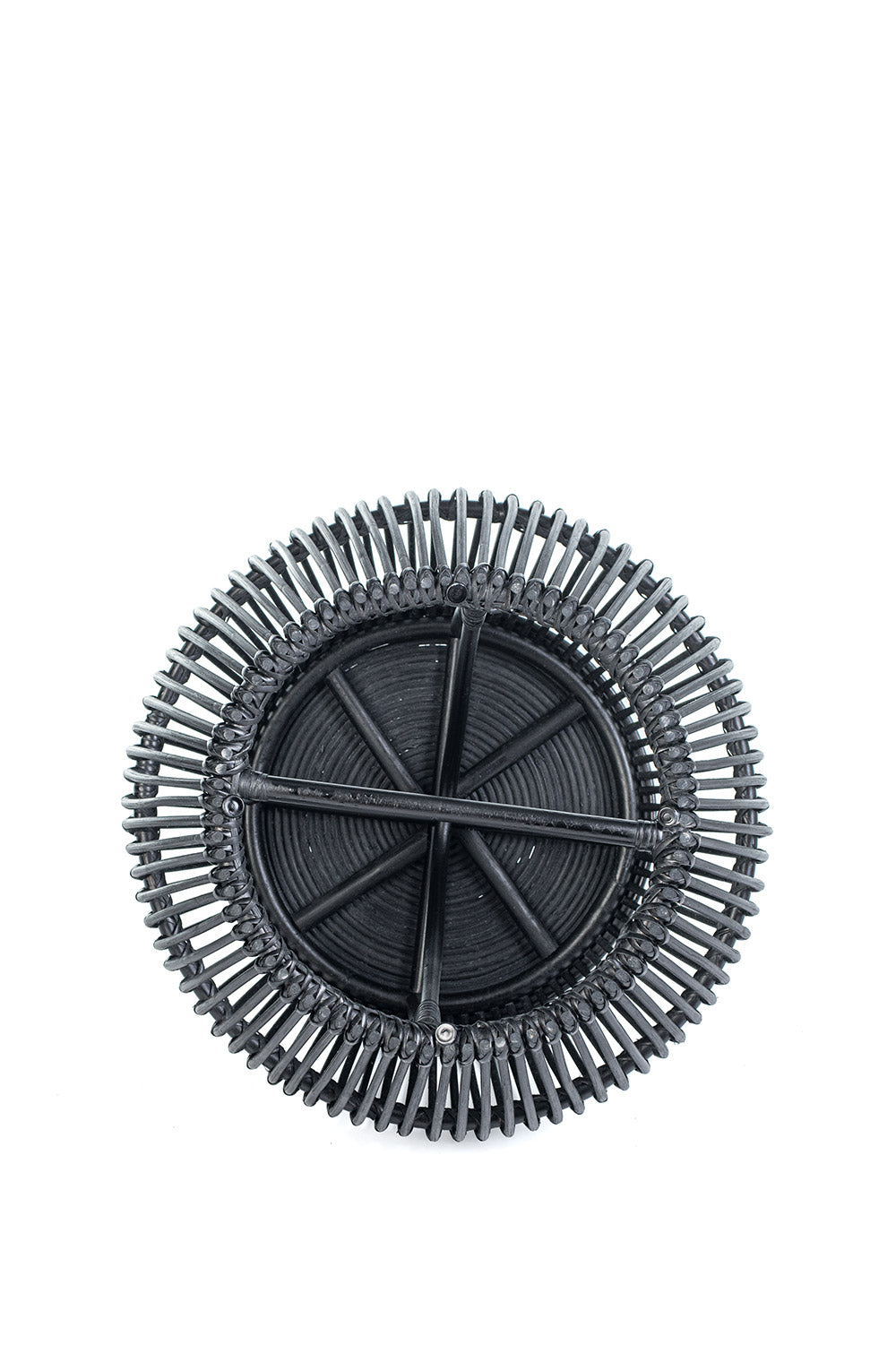 A round black coffee table made of natural rattan, with a geometric pattern, placed against a white background.