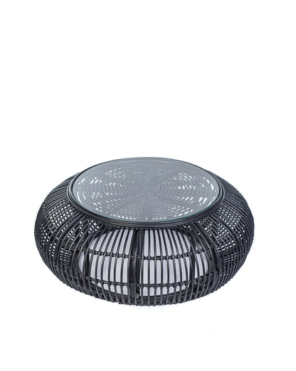 A black rattan coffee table with a glass top, suitable for indoors or outdoors use.
