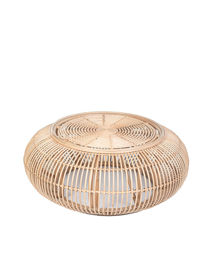 A natural color rattan coffee table with a glass top, suitable for indoors or outdoors use.
