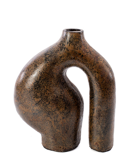 A brown ceramic vase with a unique, irregular shape, suitable for holding dry flowers and decorations.