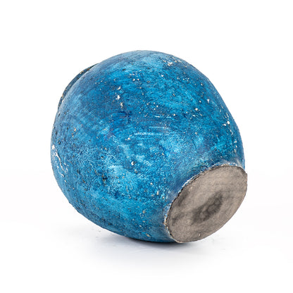 A blue ceramic decorative vase with a rustic finish.